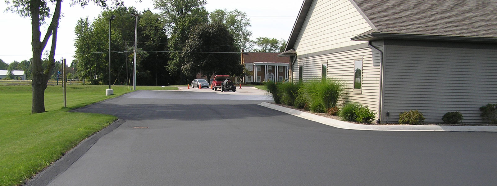 Asphalt sealcoating service for parking lots and driveways in Mansitee County and surrounding counties.