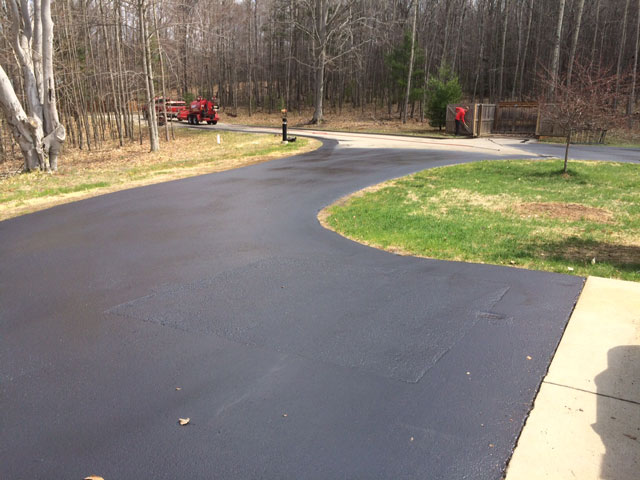 Residential Asphalt Sealcoating asphalt sealcoating end of driveway residential sealcoating ludington pentwater hart michigan mason county